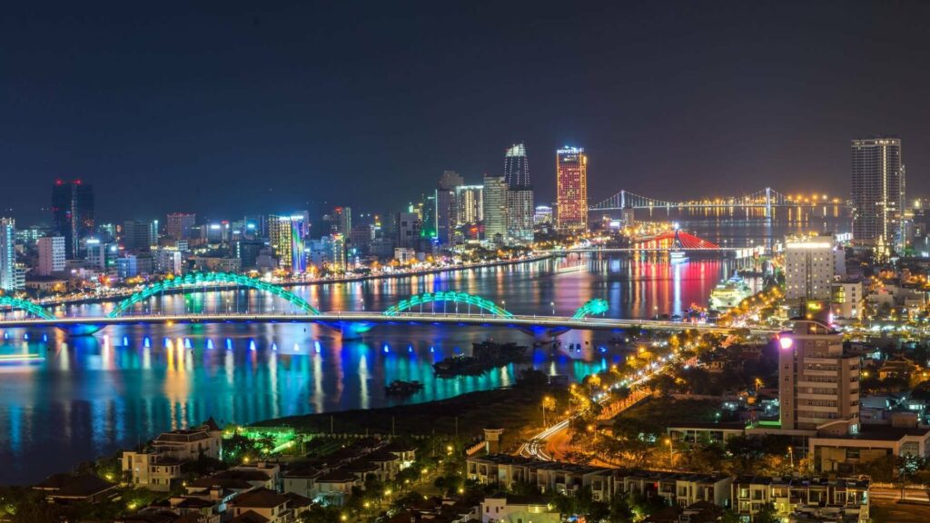 Da Nang city skyline at night with Han River and illuminated bridges